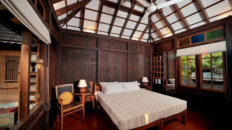 A view of a king size bed in the Heritage Cottage at Samiira on Ashtamudi Lake.
