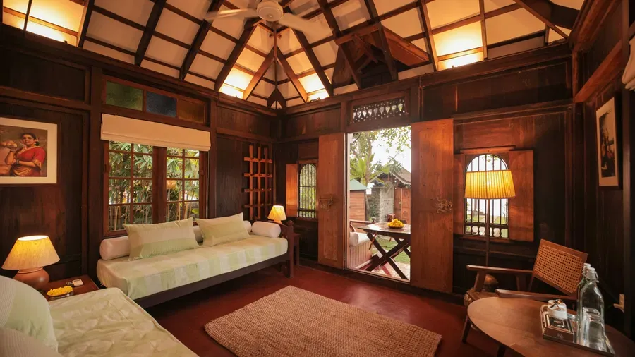 A view of the living room with comfortable seating at Heritage Cottage at Samiira on Ashtamudi Lake.