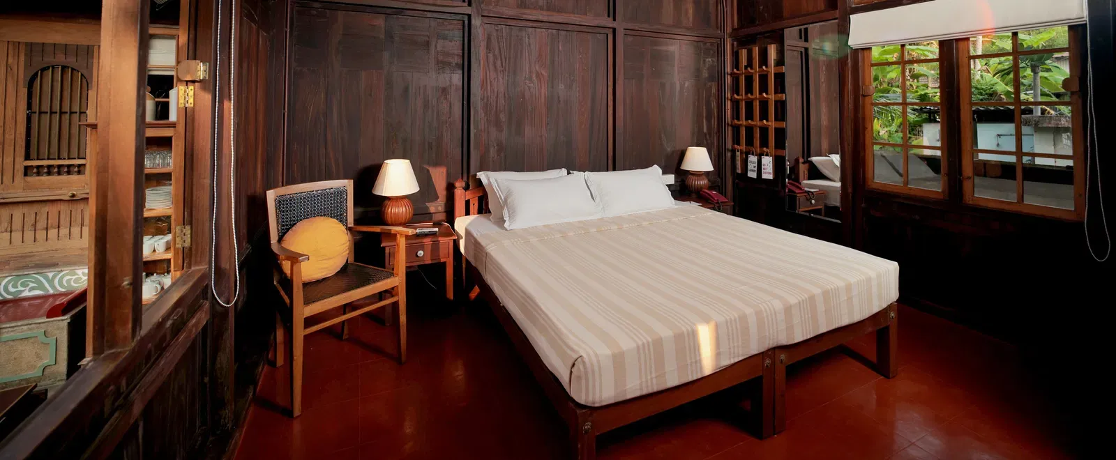 A view of a king size bed in the Heritage Cottage at Samiira on Ashtamudi Lake.