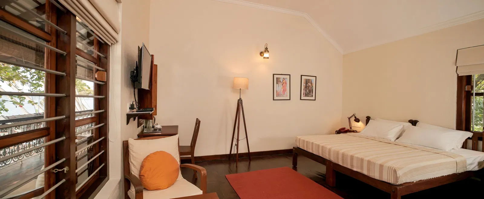 A view of a king size bed in Lake Front Verandah Room at Samiira on Ashtamudi Lake.