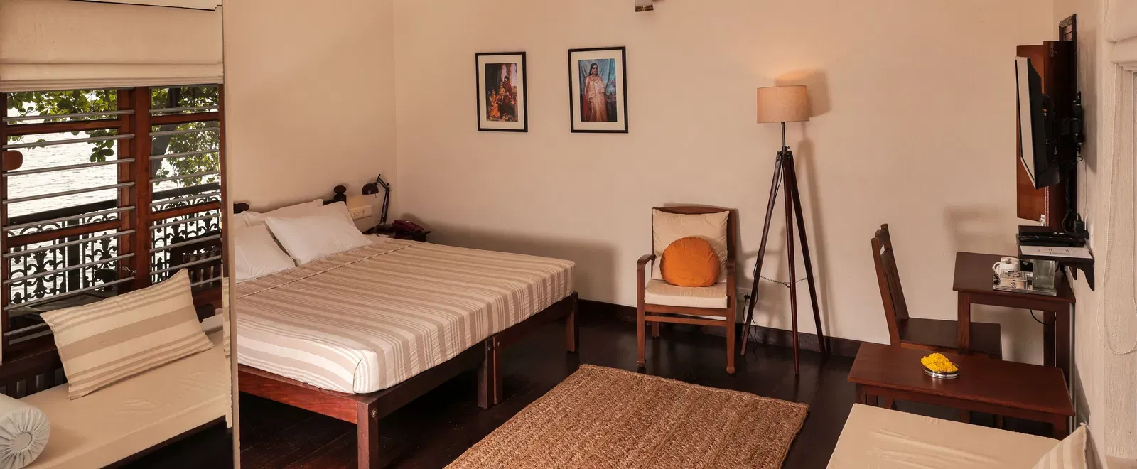A view of a king size bed in Lake Front Verandah Room at Samiira on Ashtamudi Lake.