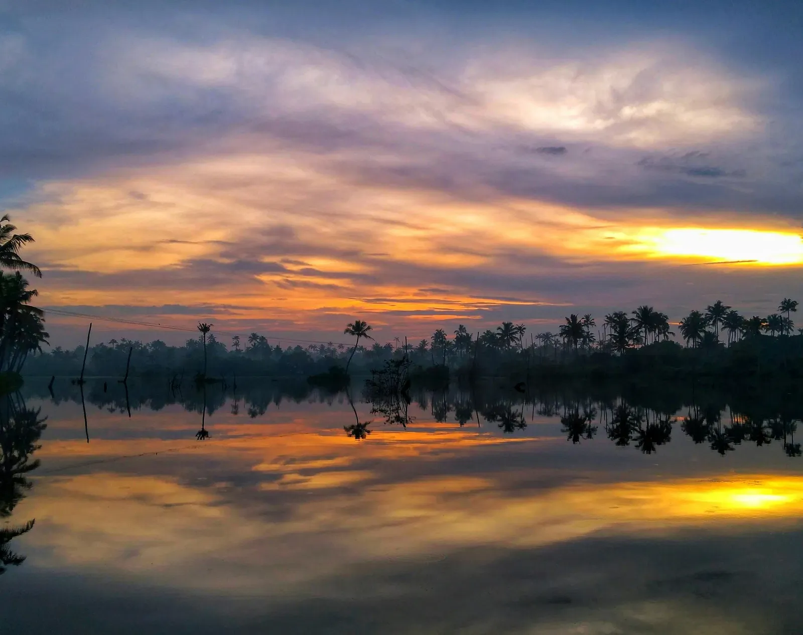 Scenic view of a lake at sunset.